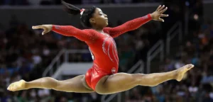 Simone Biles: Breaking Barriers, Defying Gravity, and Inspiring Hearts in Gymnastics
