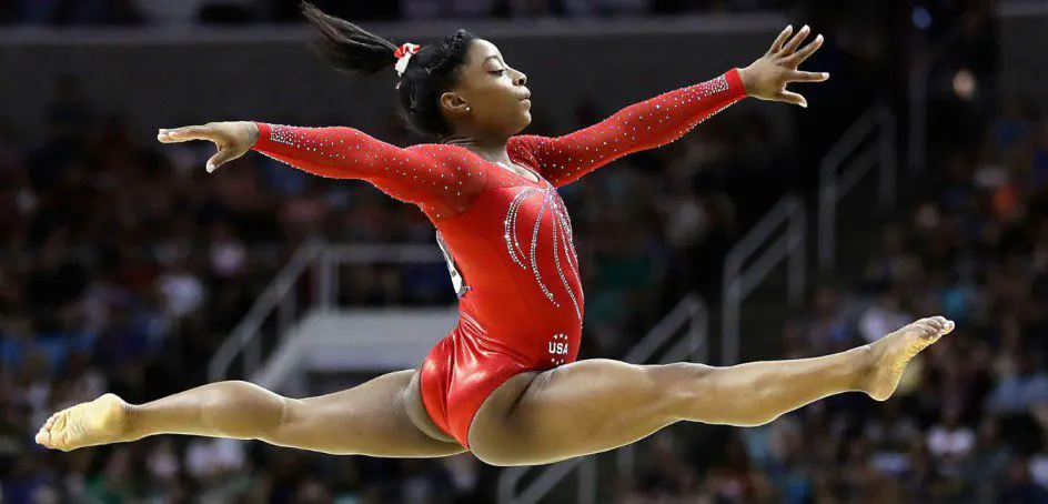 Simone Biles: Breaking Barriers, Defying Gravity, and Inspiring Hearts in Gymnastics
